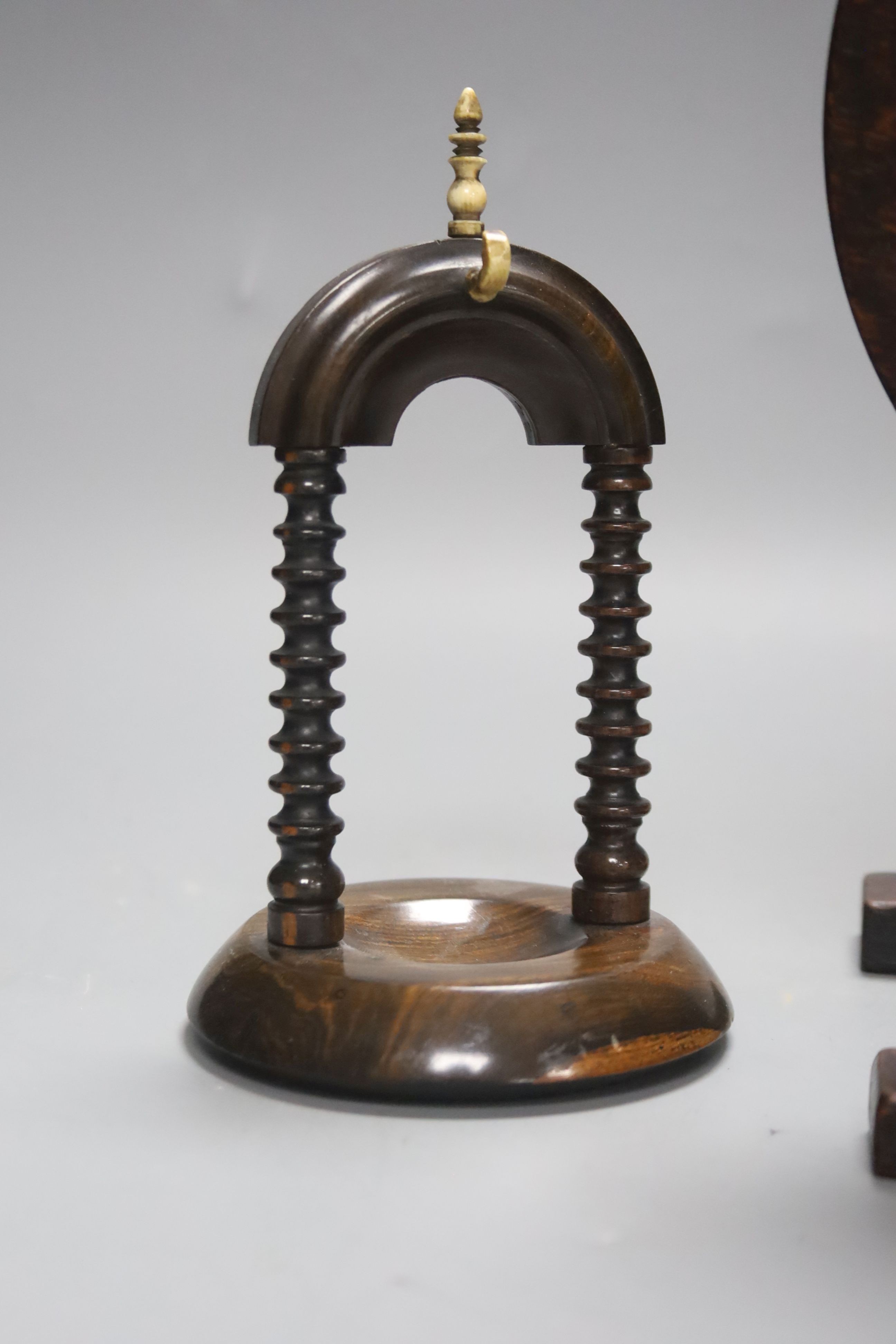 A 19th century oak miniature tilt top table with naval portrait, 23.5cm high tilted up, and a lignum vitae watchstand